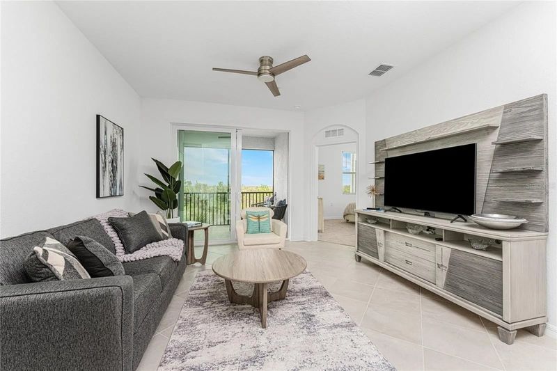 Living room with comfy seating and 55-inch Smart TV