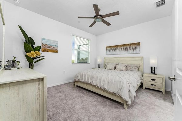 Primary bedroom with king bed and attached bathroom
