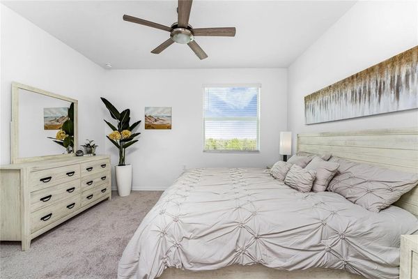 Primary bedroom with king bed and attached bathroom