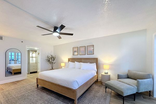 Primary Suite King Bed with sitting chair