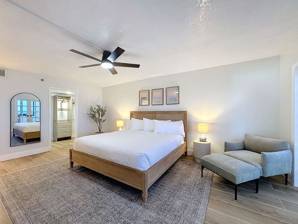 Primary Suite King Bed with sitting chair