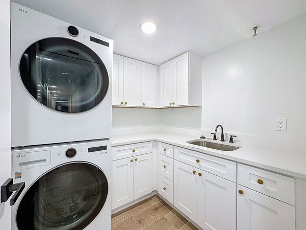 Laundry Room with full size LG ThinQ washer and dryer
