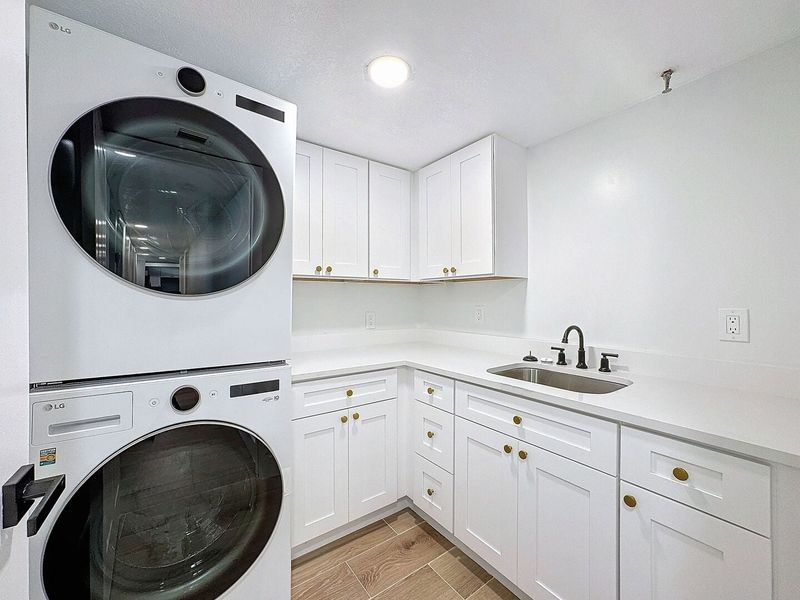 Laundry Room with full size LG ThinQ washer and dryer