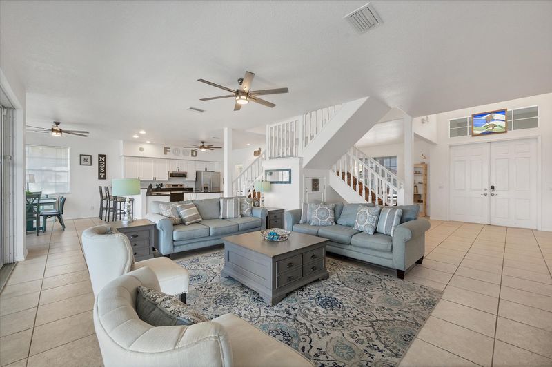 Beautiful, bright, open living space with fantastic view of the pool area and canal beyond