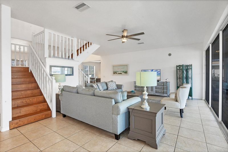 Beautiful, bright, open living space with fantastic view of the pool area and canal beyond. Living room also features a secret Harry Potter room under the staircase
