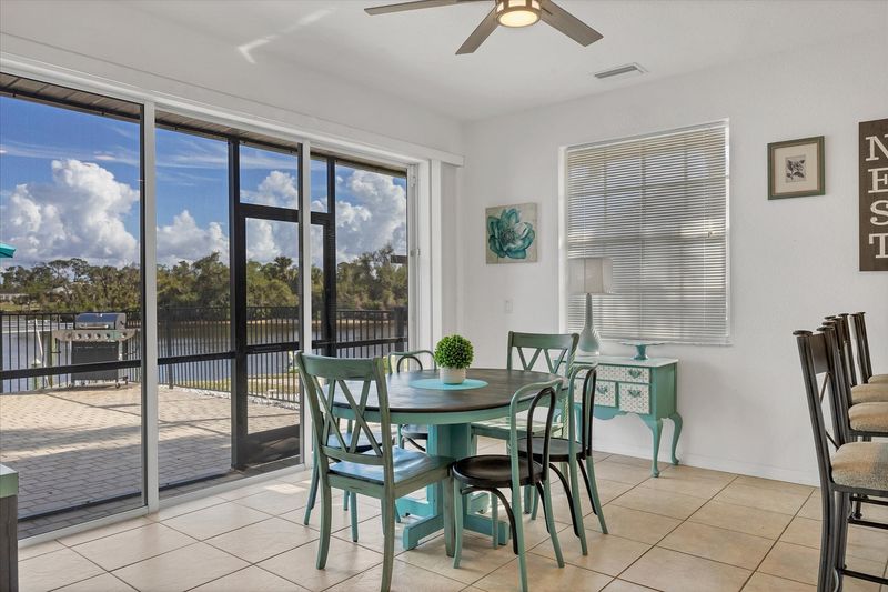 Kitchen nook with lanai access. Kitchen table seats 6 with an additional 3 seats at the kitchen bar
