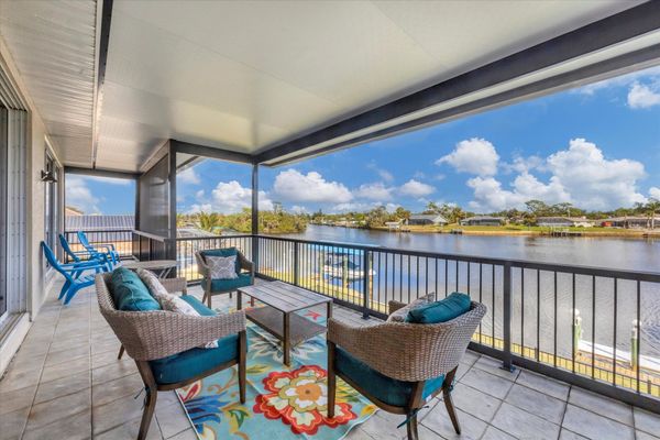 Balcony overlooking pool and water