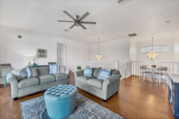 Loft with balcony access. Loft features comfy sofas, desk, queen sleeper sofa, 42" Smart TV and poker table