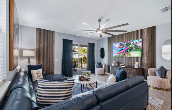 Gather in the spacious living room, designed with comfort in mind and ideal for entertaining guests or enjoying family time.