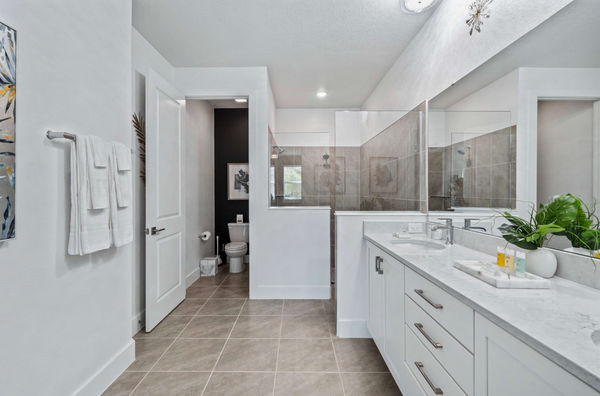 Refresh yourself in the modern shower area, featuring sleek fixtures and ample space for a rejuvenating experience