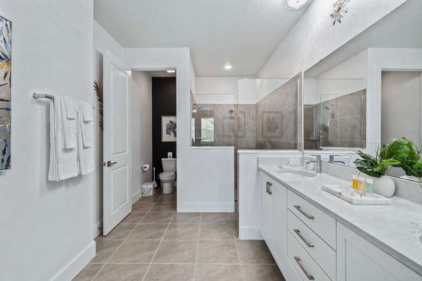 Refresh yourself in the modern shower area, featuring sleek fixtures and ample space for a rejuvenating experience
