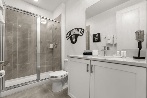 Enjoy the convenience of an en-suite bathroom featuring a walk-in shower for a refreshing start to your day