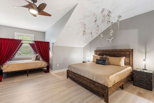 This bedroom has a King and a Queen bed perfect for large groups