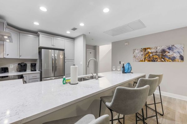 Sit down at the bar top whilst the family cooks up some home cooked meals