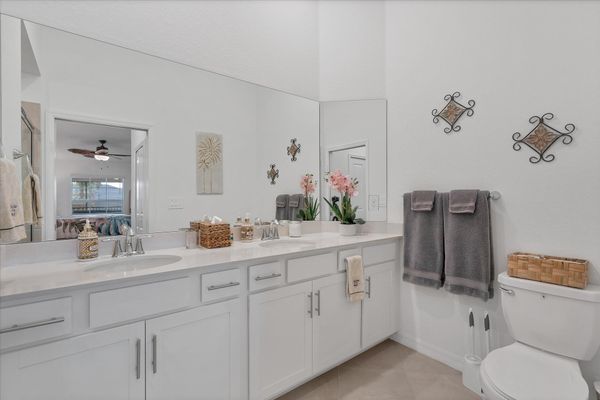 En suite with walk-in shower and double vanities