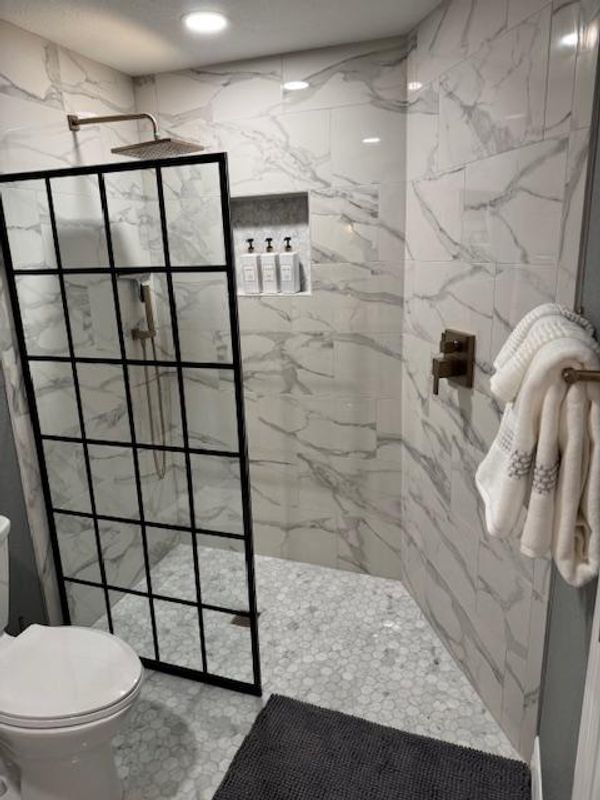 Guest bedroom 4's attached bathroom with walk-in shower