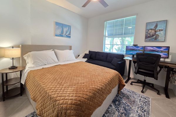 Bedroom #3 features office space with desk & chair, 2 monitors, printer and sofa