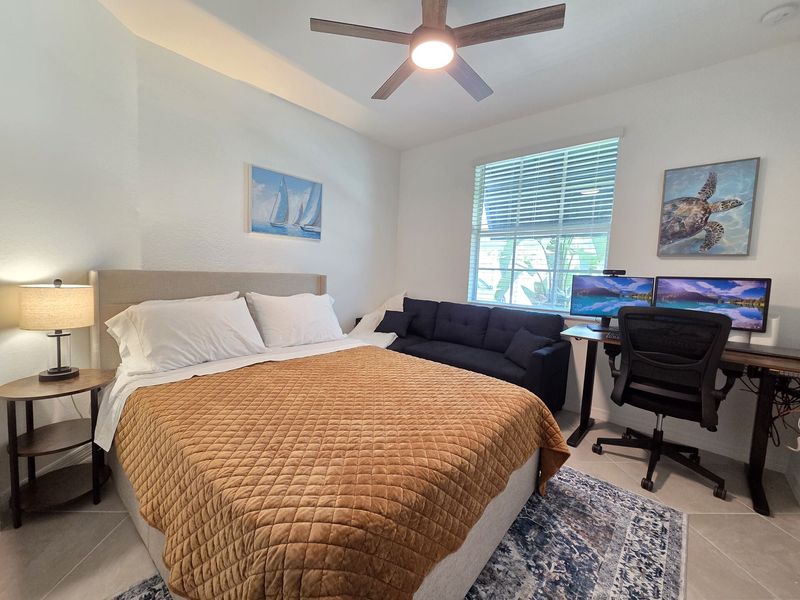 Bedroom #3 features office space with desk & chair, 2 monitors, printer and sofa