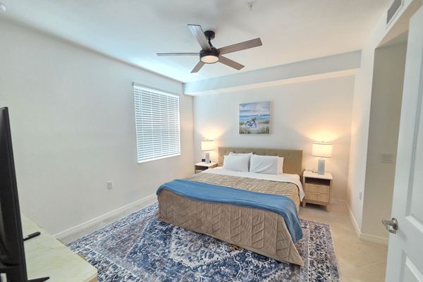 Primary bedroom with king bed, 50-inch Smart TV and attached bathroom