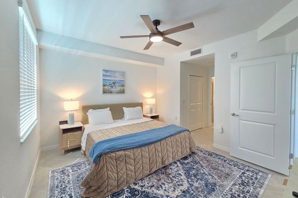 Primary bedroom with king bed, 50-inch Smart TV and attached bathroom
