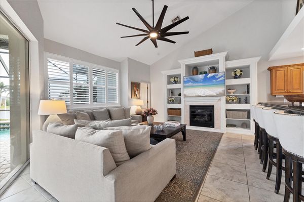 Comfy, Bright Living Room with Electric Fireplace and 65" Smart TV