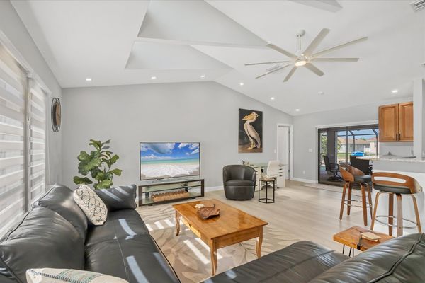 Large, Open, and Bright Living Area with 65" Smart TV