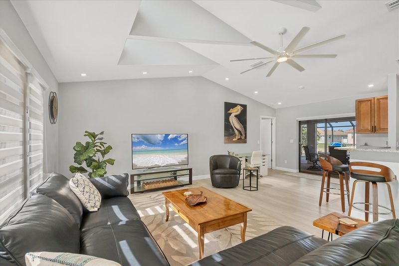Large, Open, and Bright Living Area with 65" Smart TV