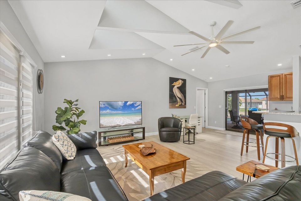 Large, Open, and Bright Living Area with 65" Smart TV