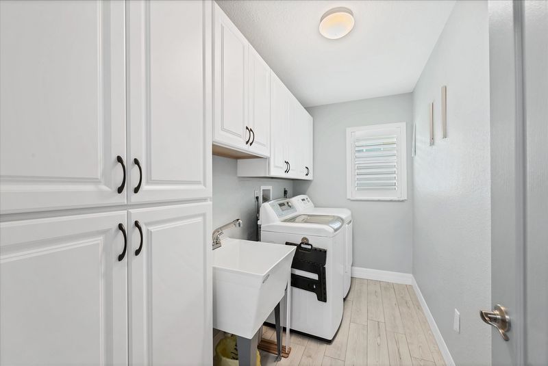 Laundry room with full-size washer and dryer