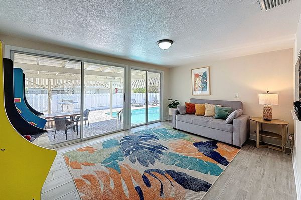 Game room featuring arcade games such as Pac Man, Mrs. Pac Man and more. This room also has a sofa sleeper