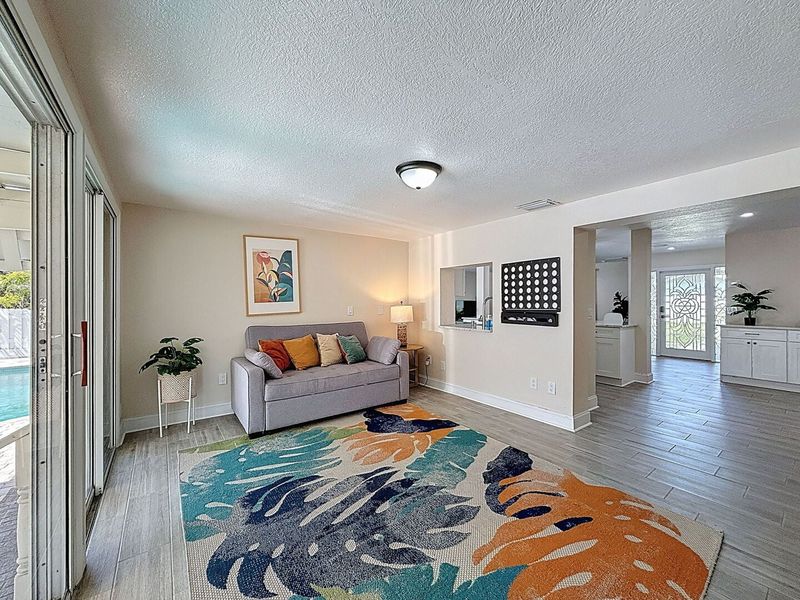 Game Room with sliders to backyard. Sofa Sleeper
