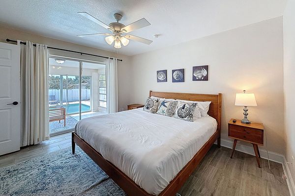 Primary Bedroom with sliders to outdoor patio with pool access
