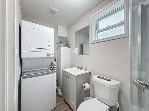 Laundry in Primary Bathroom - Half size stackable washer & dryer