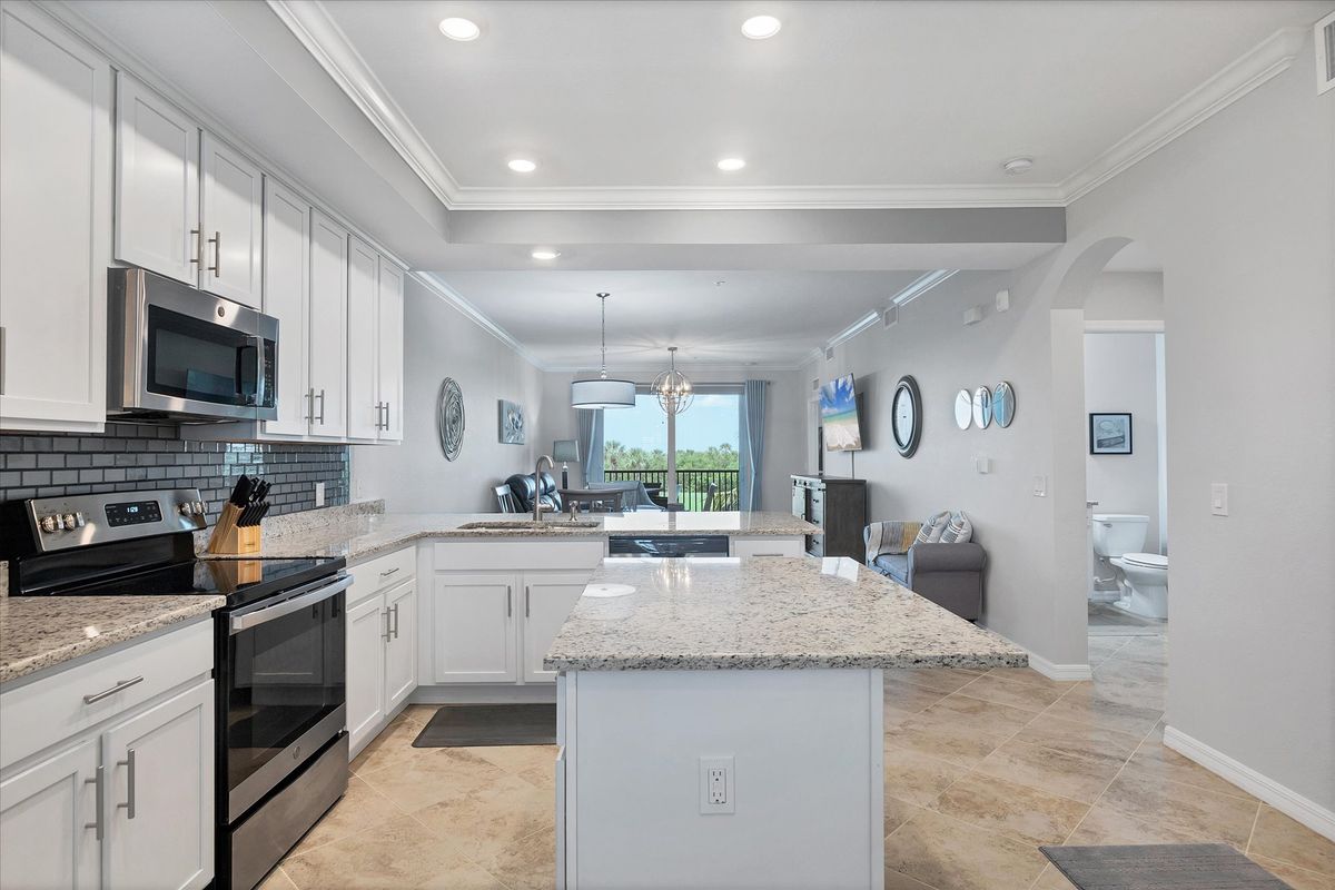 Beautiful, full-equipped kitchen overlooking living and dining areas