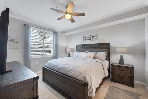 Primary bedroom with king bed and attached bathroom
