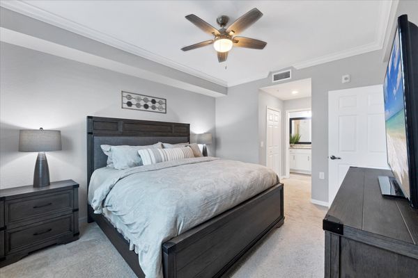 Primary bedroom with king bed and attached bathroom