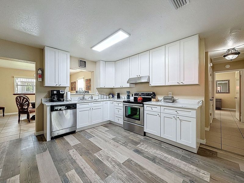 Kitchen with stainless dishwasher and stove