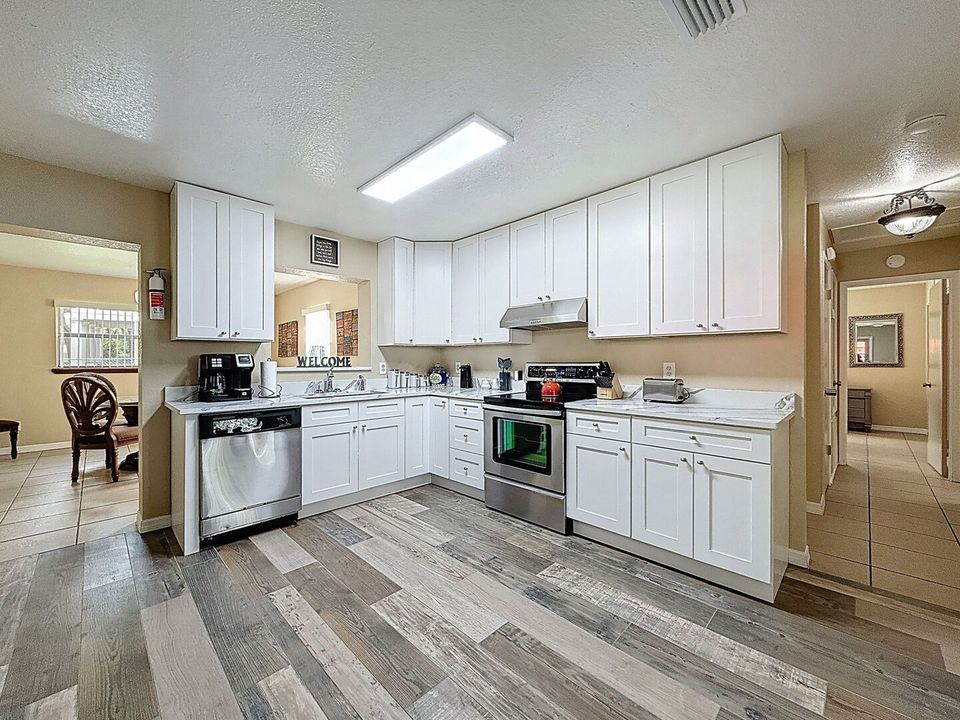 Kitchen with stainless dishwasher and stove
