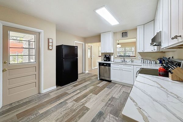 Kitchen showing door that exits to the carport