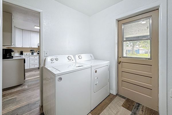 Laundry Room with exit door to the carport