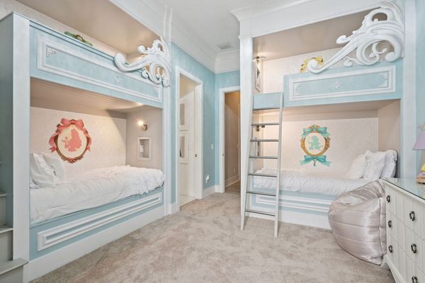 Little royals will adore this magical princess bedroom featuring six custom bunk beds fit for a fairy tale. Delicate details, soft pastel tones, and whimsical artwork bring the enchantment to life