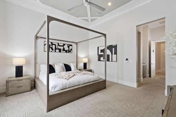 Retreat to a serene master bedroom featuring a king bed with a premium mattress and elegant furnishings.
