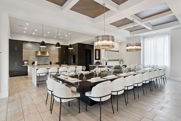 Designed for large gatherings, this elegant dining area seats up to 27 guests with ease. The perfect setting for family celebrations or group meals.