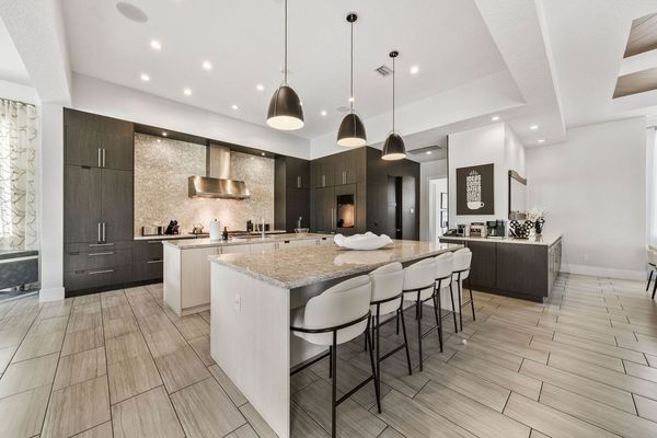 Chef's Kitchen with dual oven and range, dual microwave, dual dishwasher oversized refrigerator, pantry and ample storage