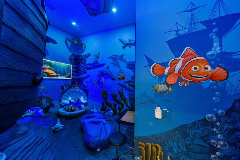 Step into an ocean adventure hidden just off the corridor! This immersive room features interactive sound effects, a smart TV, and a multi-game cocktail table for hours of family fun. A magical hideaway where playtime meets imagination.