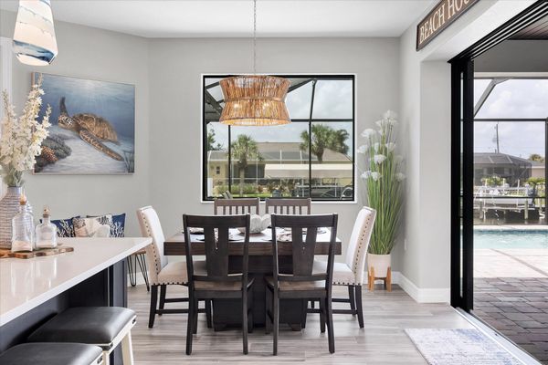 Dining seats 8 with additional seating for 4 at the kitchen island