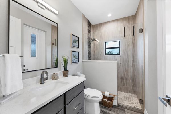 Guest bathroom with walkin shower and lanai access