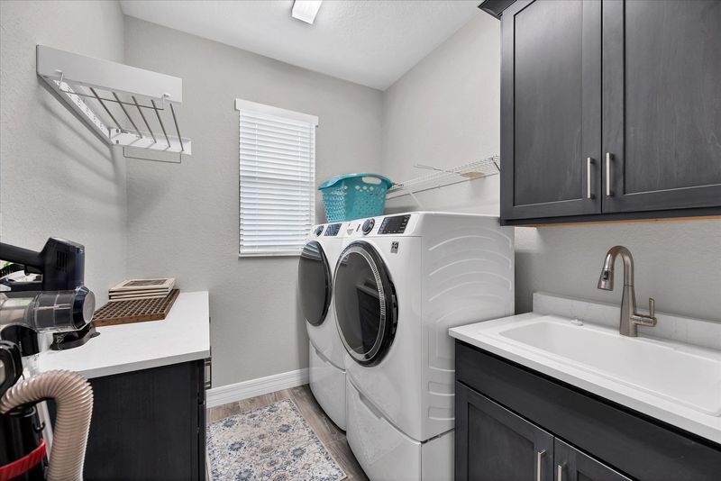 Laundry room with full-size washer and dryer