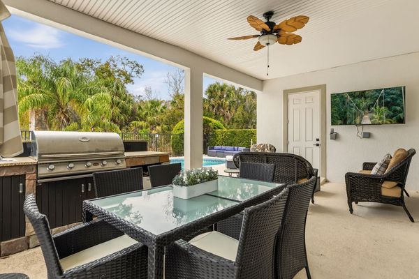 Relax and enjoy time with the family by the summer kitchen and pool