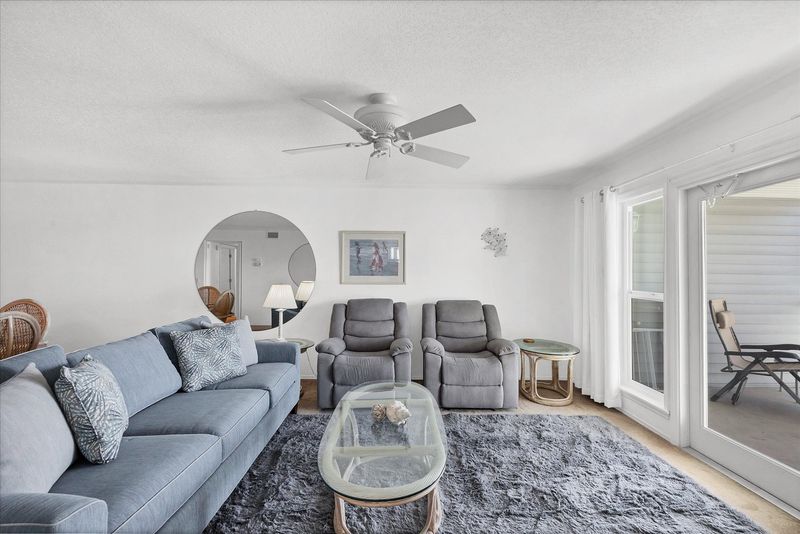 Open living space overlooking the community pool and Myakka River